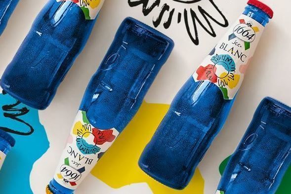 This summer, the bottle of 1664 Blanc is decked out in the colors